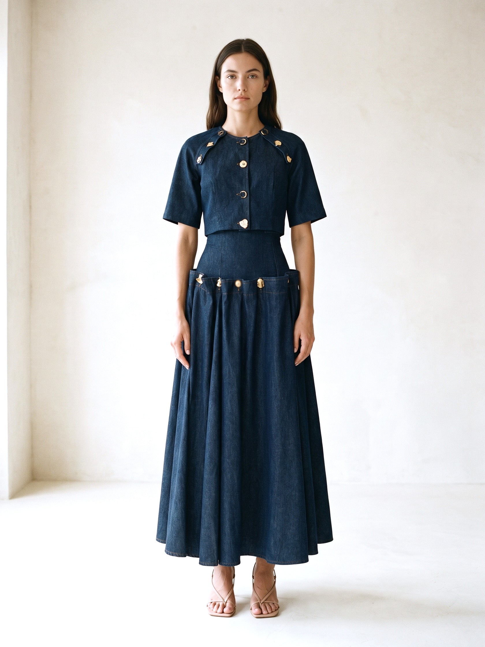 Model in a navy denim crop shirt and matching denim maxi skirt set