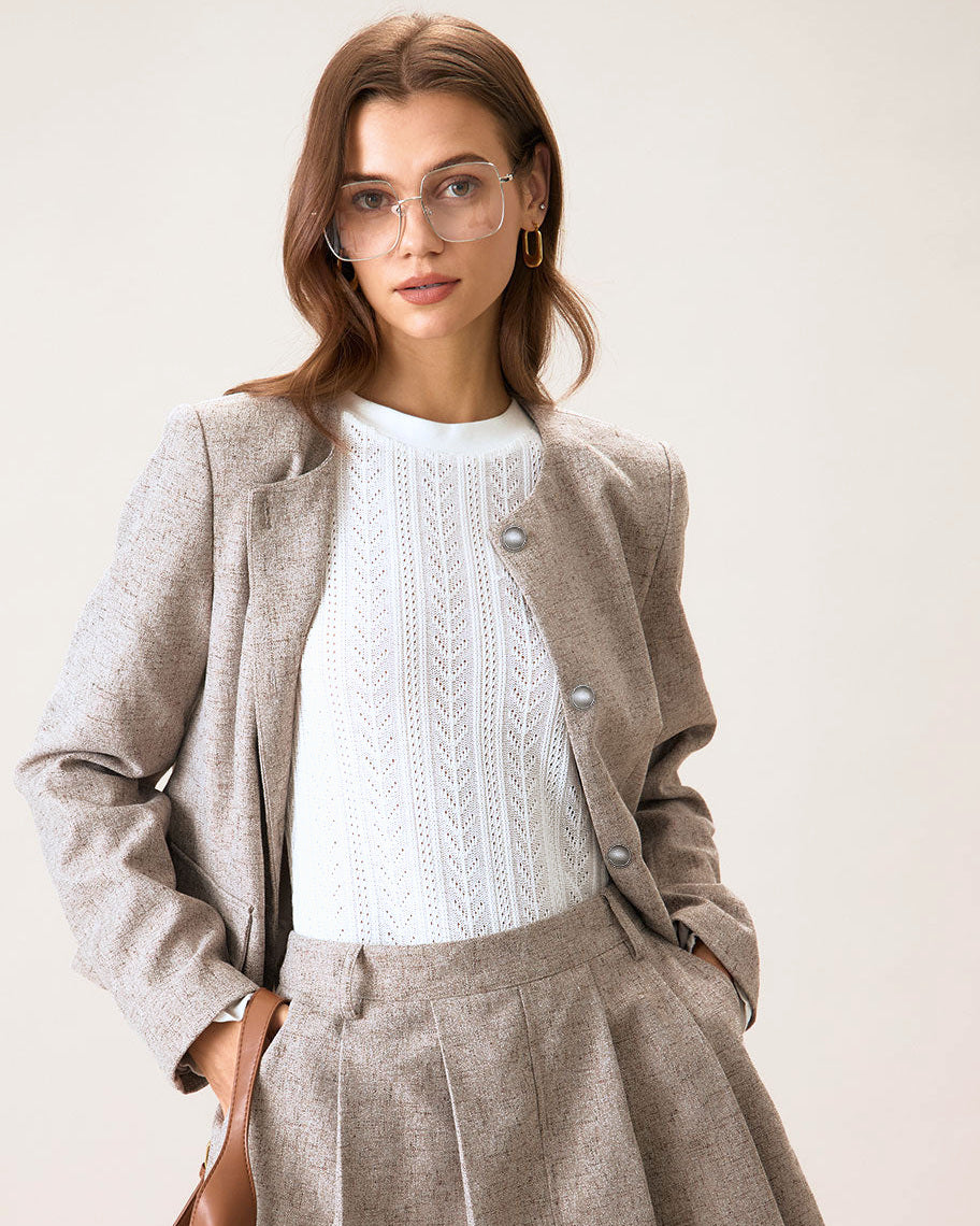 Matching sets - oatmeal wool blazer and pleated mini skirt worn with tall boots
