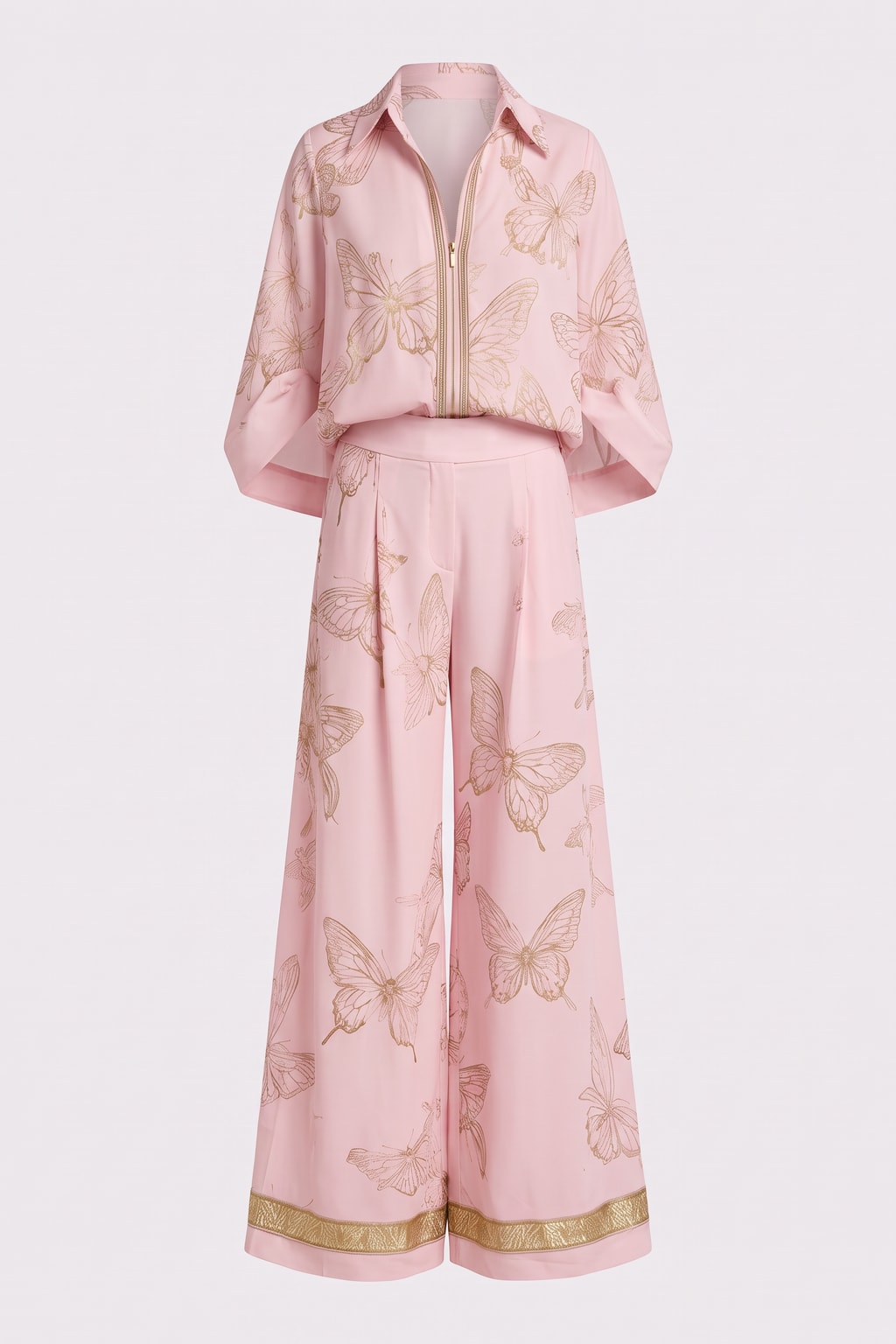 Pink two-piece set with a gold butterfly print, a zip-front collared shirt and wide-leg pants finished with gold metallic hem trim