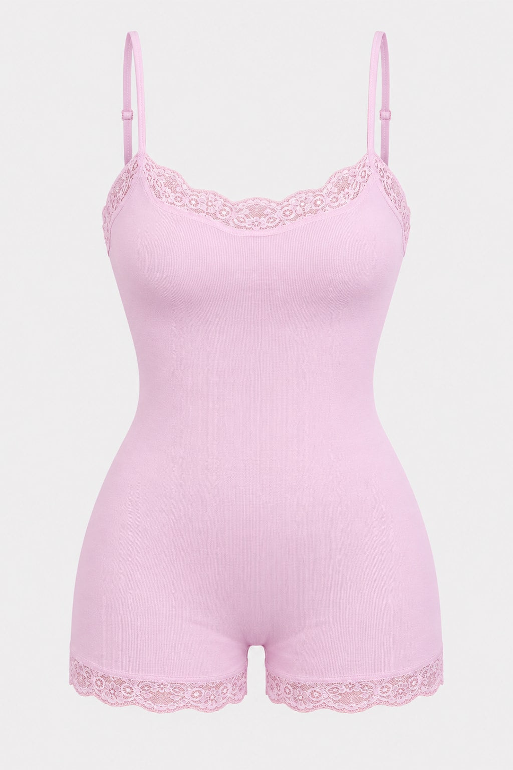 Pink ribbed knit playsuit with scalloped lace trim at the neckline and leg openings and adjustable straps