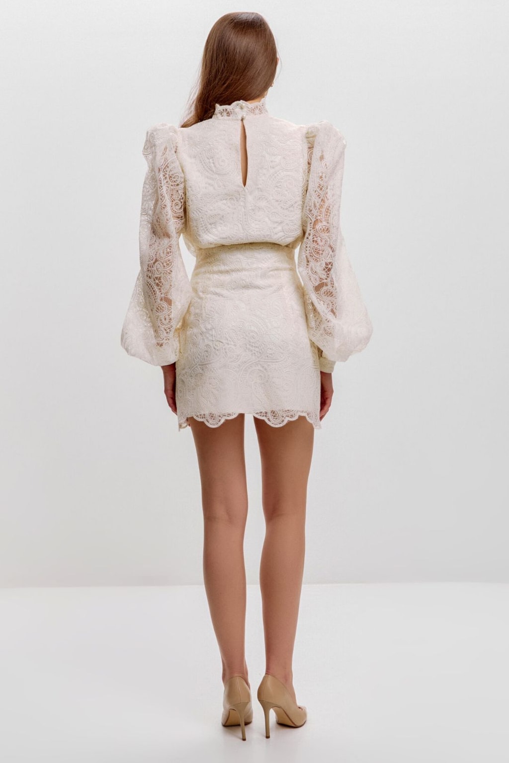 Full-length back view of the ivory lace set with scalloped mini skirt hem