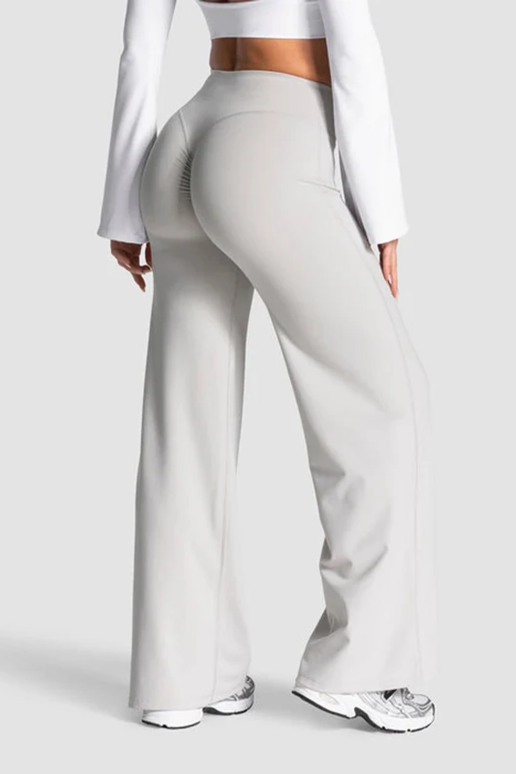 High waist flare yoga pants in light grey with a V back waistband and a centre scrunch seam