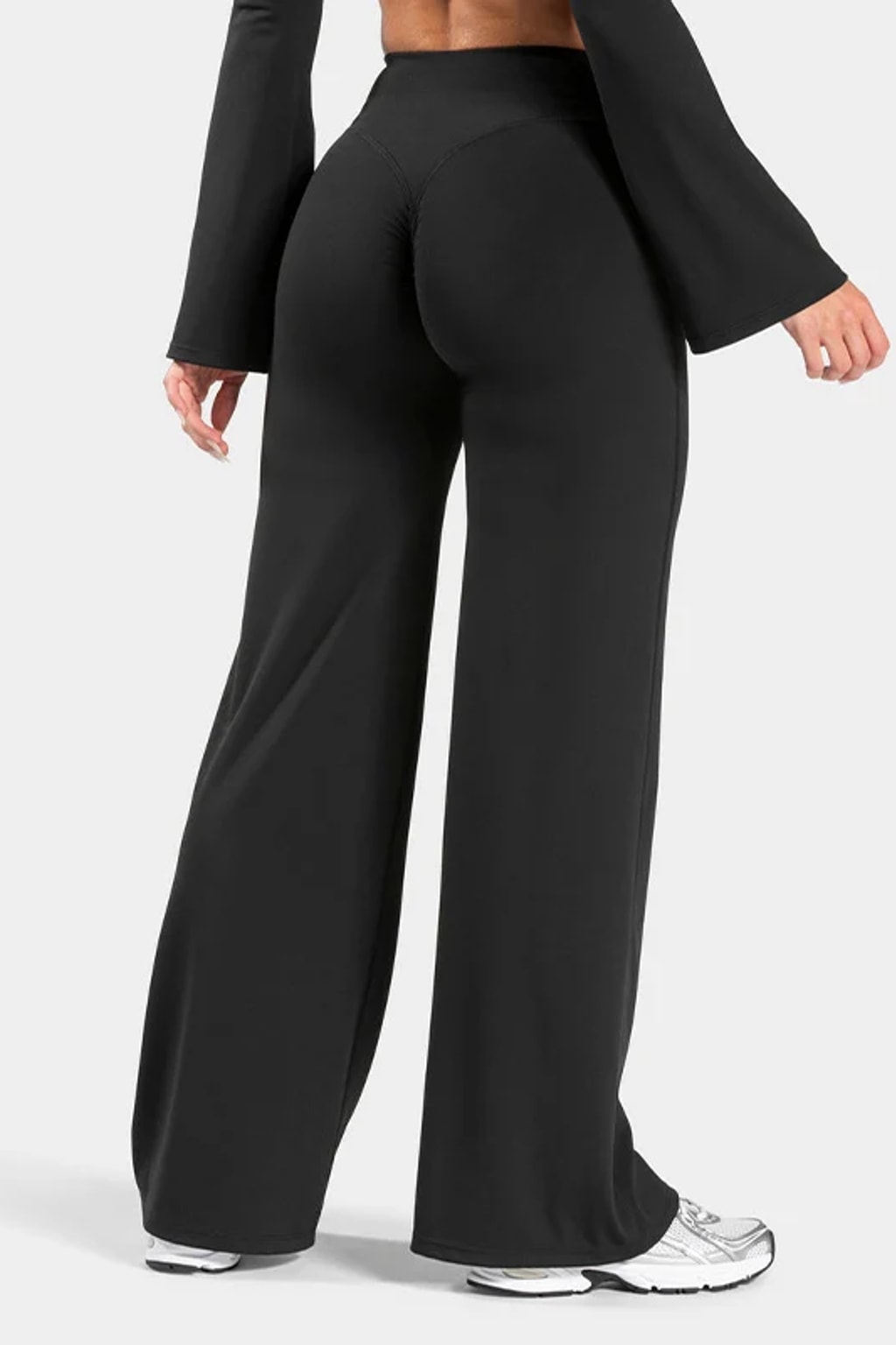 Black high waist flare yoga pants with a V back waistband and a centre scrunch seam