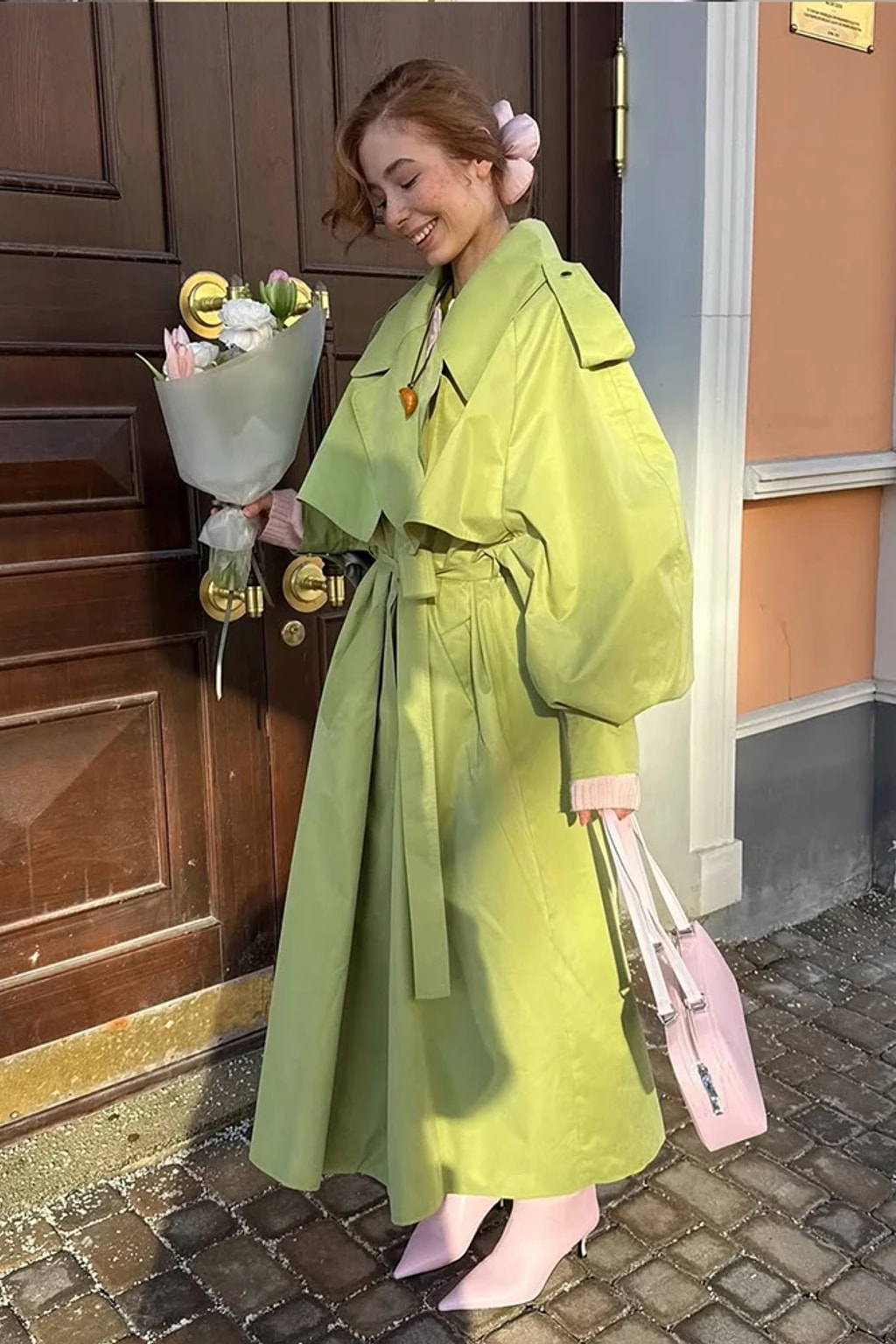 Lime green oversized maxi trench coat with a wide self-tie belt, storm flap and buckled cuff tabs