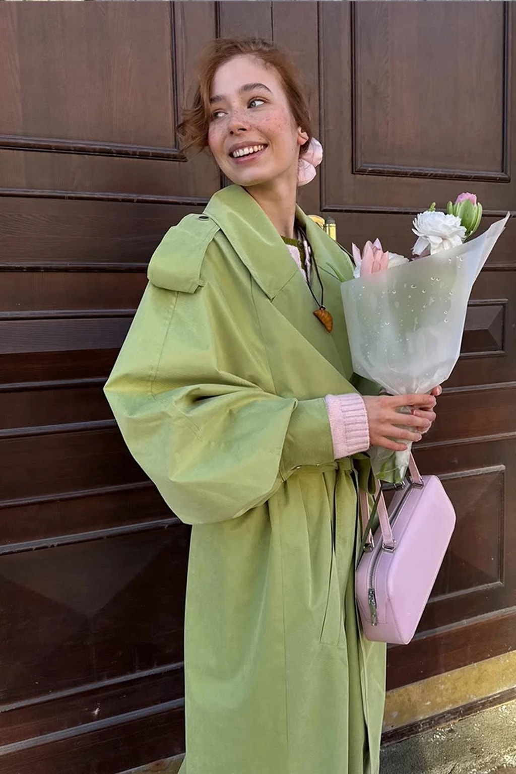 Lime green oversized maxi trench coat with a wide self-tie belt, storm flap and buckled cuff tabs