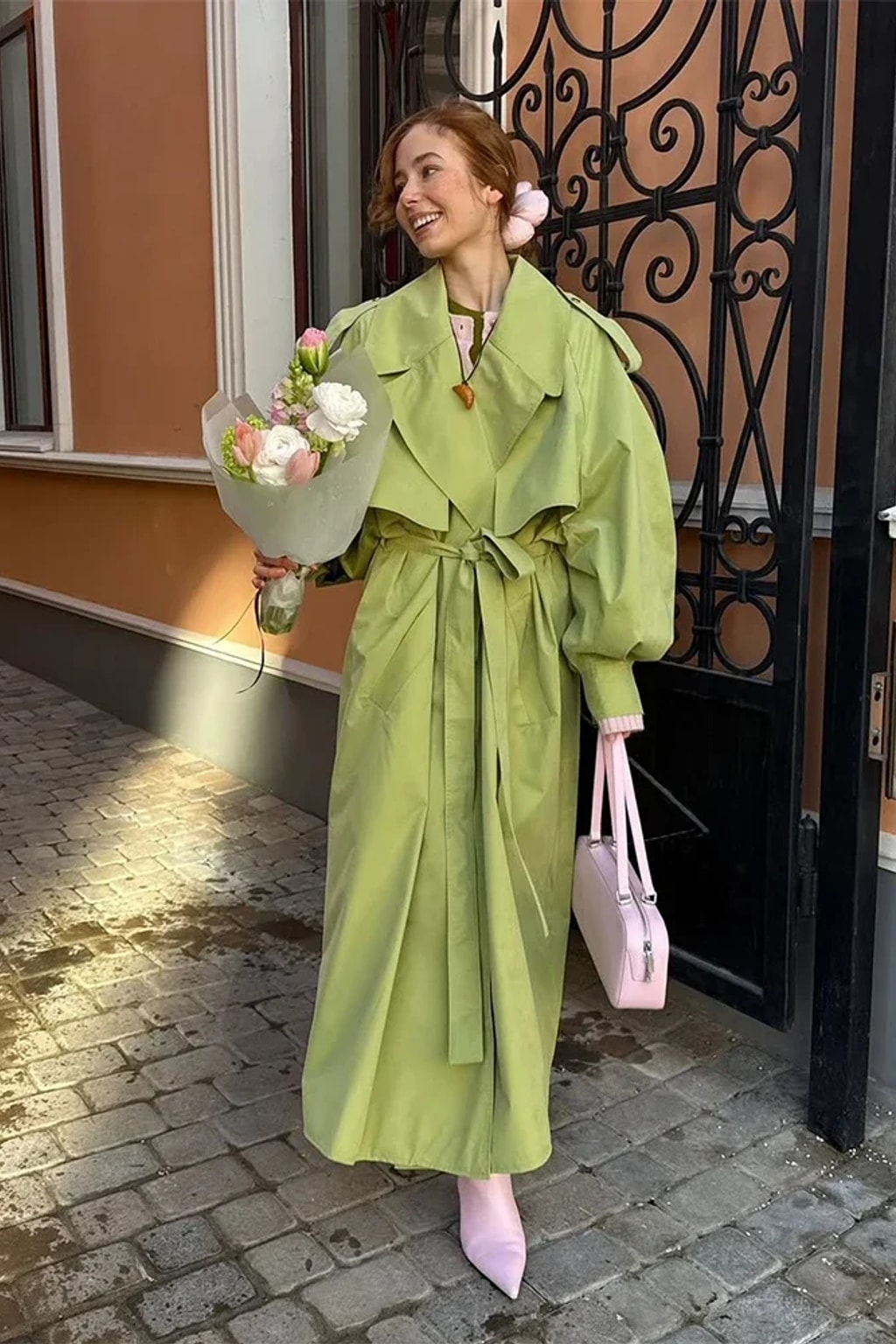 Lime green oversized maxi trench coat with a wide self-tie belt, storm flap and buckled cuff tabs