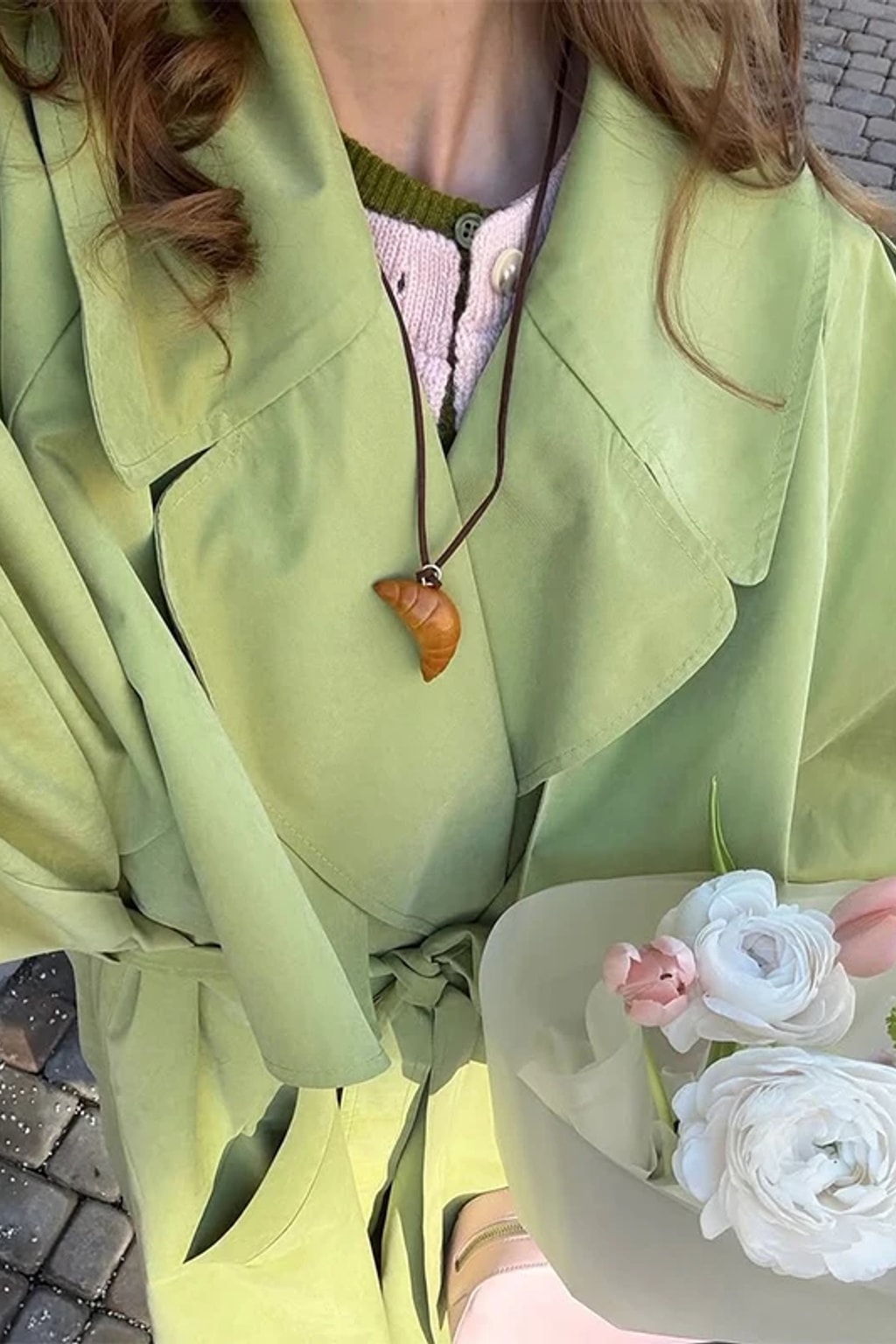 Lime green oversized maxi trench coat with a wide self-tie belt, storm flap and buckled cuff tabs