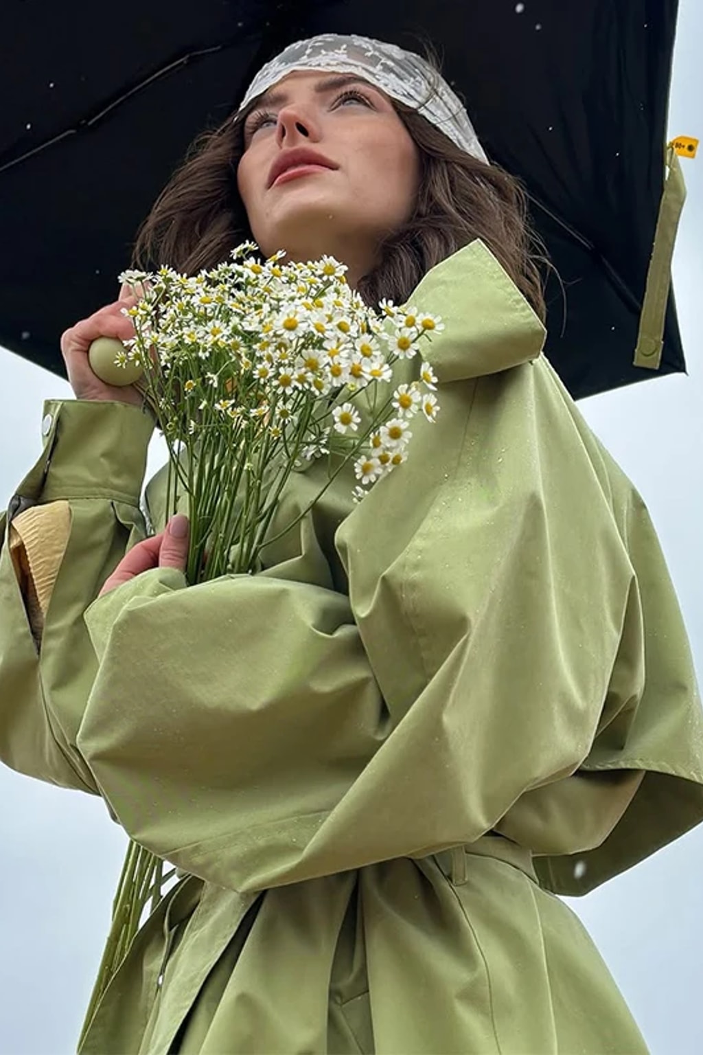 Lime green oversized maxi trench coat with a wide self-tie belt, storm flap and buckled cuff tabs