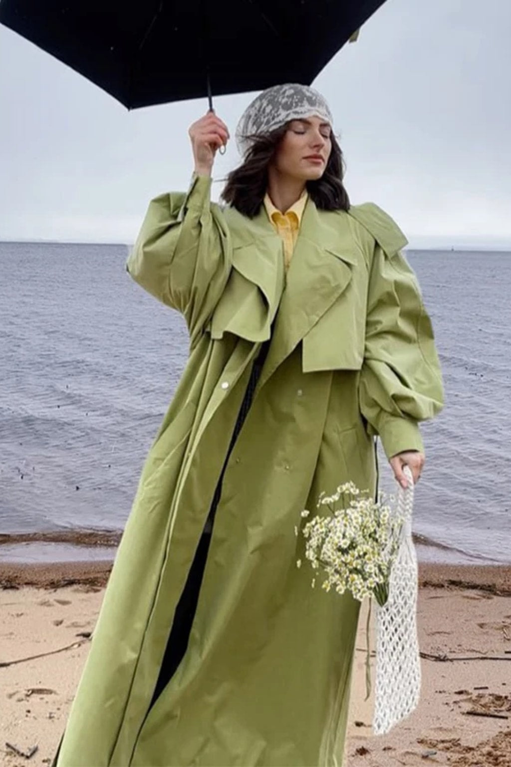 Lime green oversized maxi trench coat with a wide self-tie belt, storm flap and buckled cuff tabs