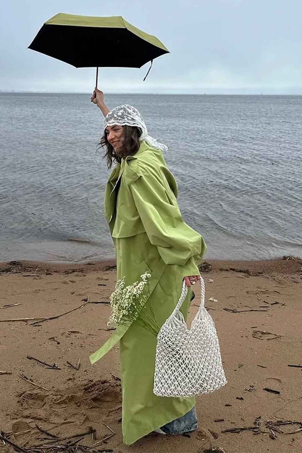 Lime green oversized maxi trench coat with a wide self-tie belt, storm flap and buckled cuff tabs