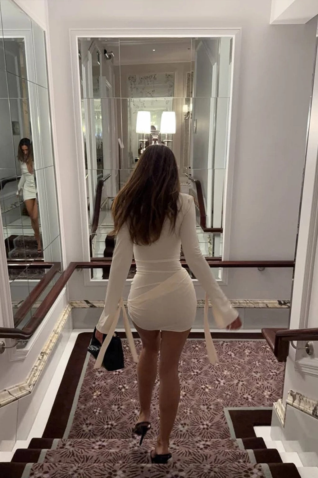 Cream collared mini dress with a full covered-button front, asymmetric ruched skirt and slim tie cuffs