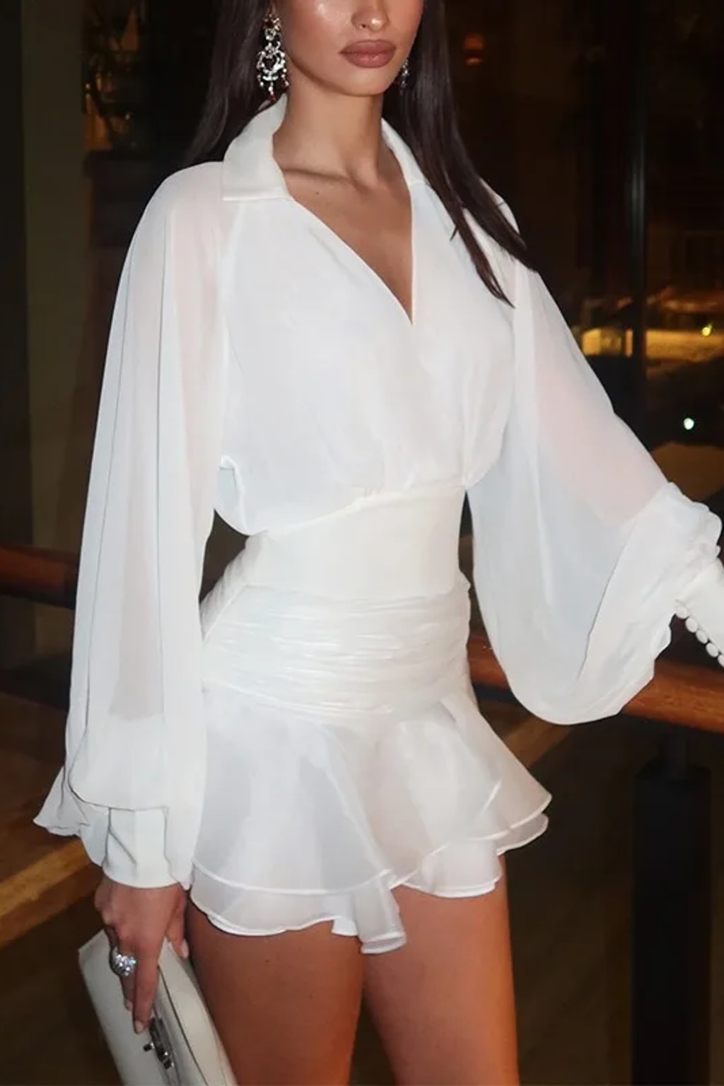 White two-piece set with an open-back chiffon blouse with balloon sleeves and a ruched-waist ruffle mini skirt