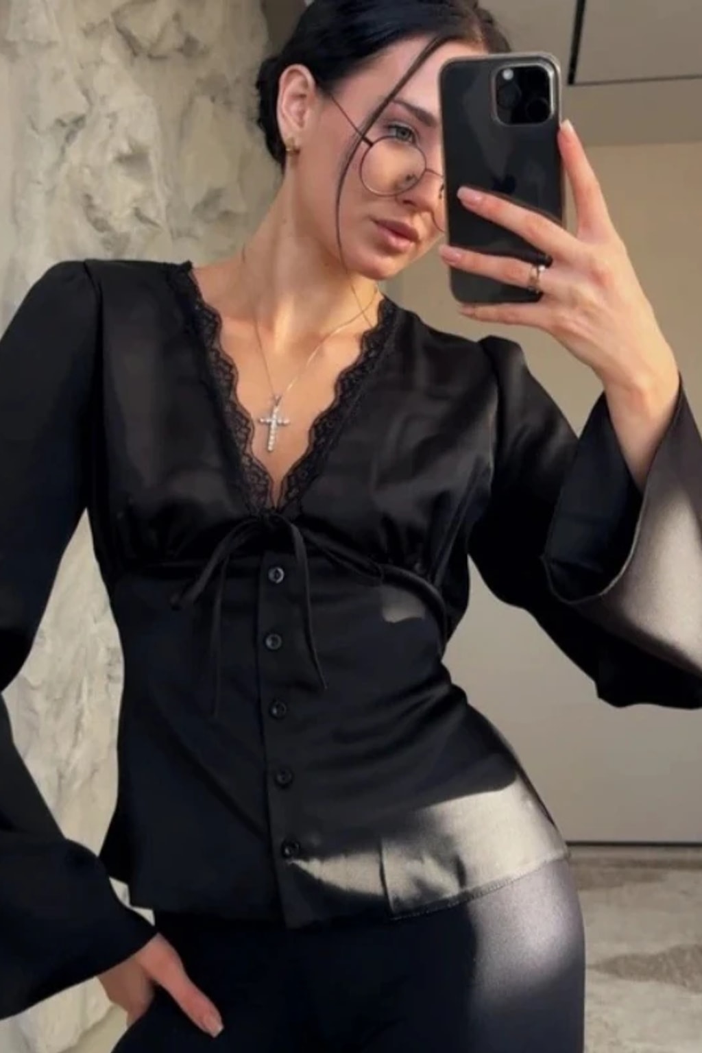Satin blouse with scalloped lace at the deep V neckline, a tie bow and wide flared bell cuffs