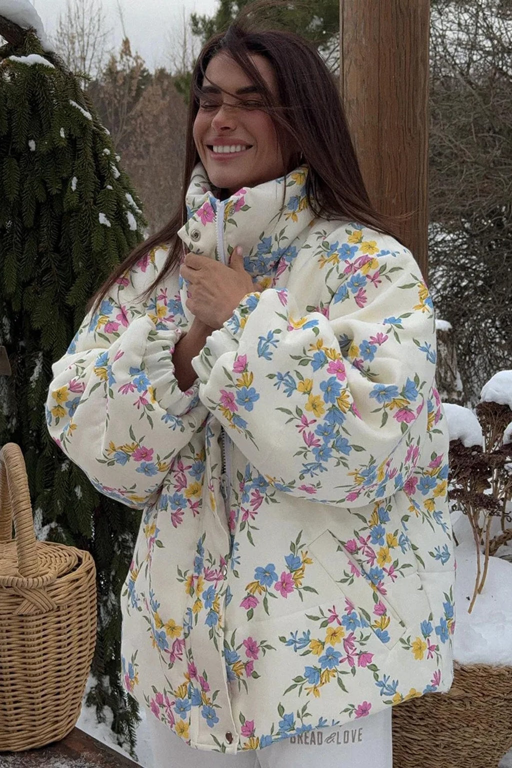 Cream oversized puffer jacket in a ditsy floral print with a tall stand collar and full zip