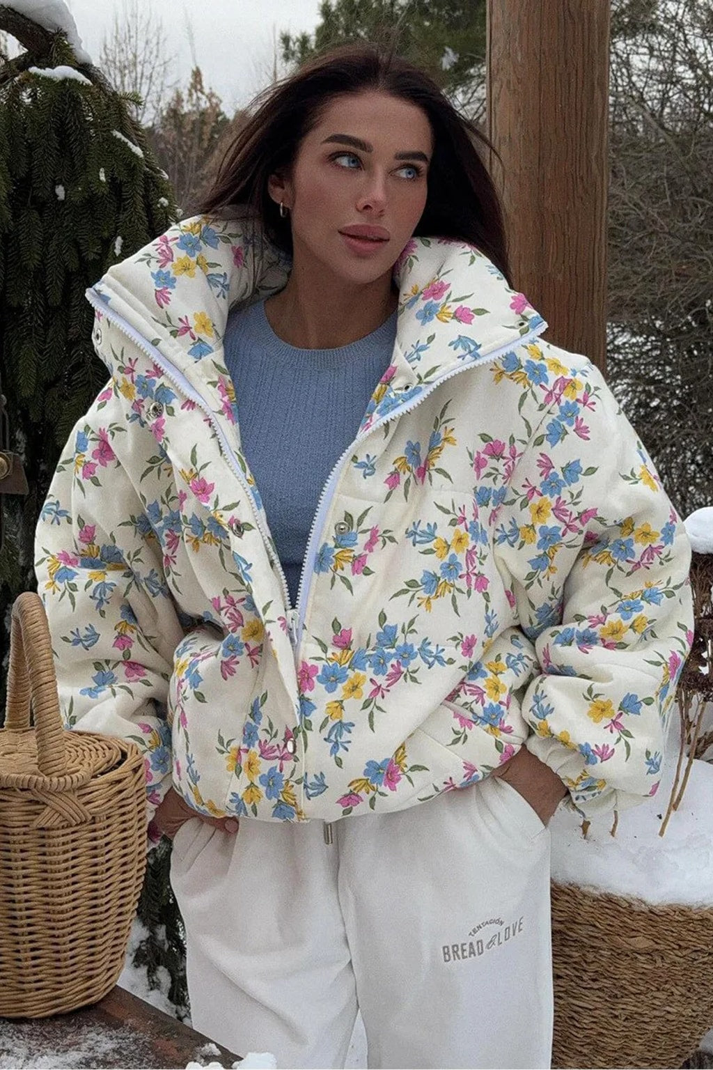 Cream oversized puffer jacket in a ditsy floral print with a tall stand collar and full zip