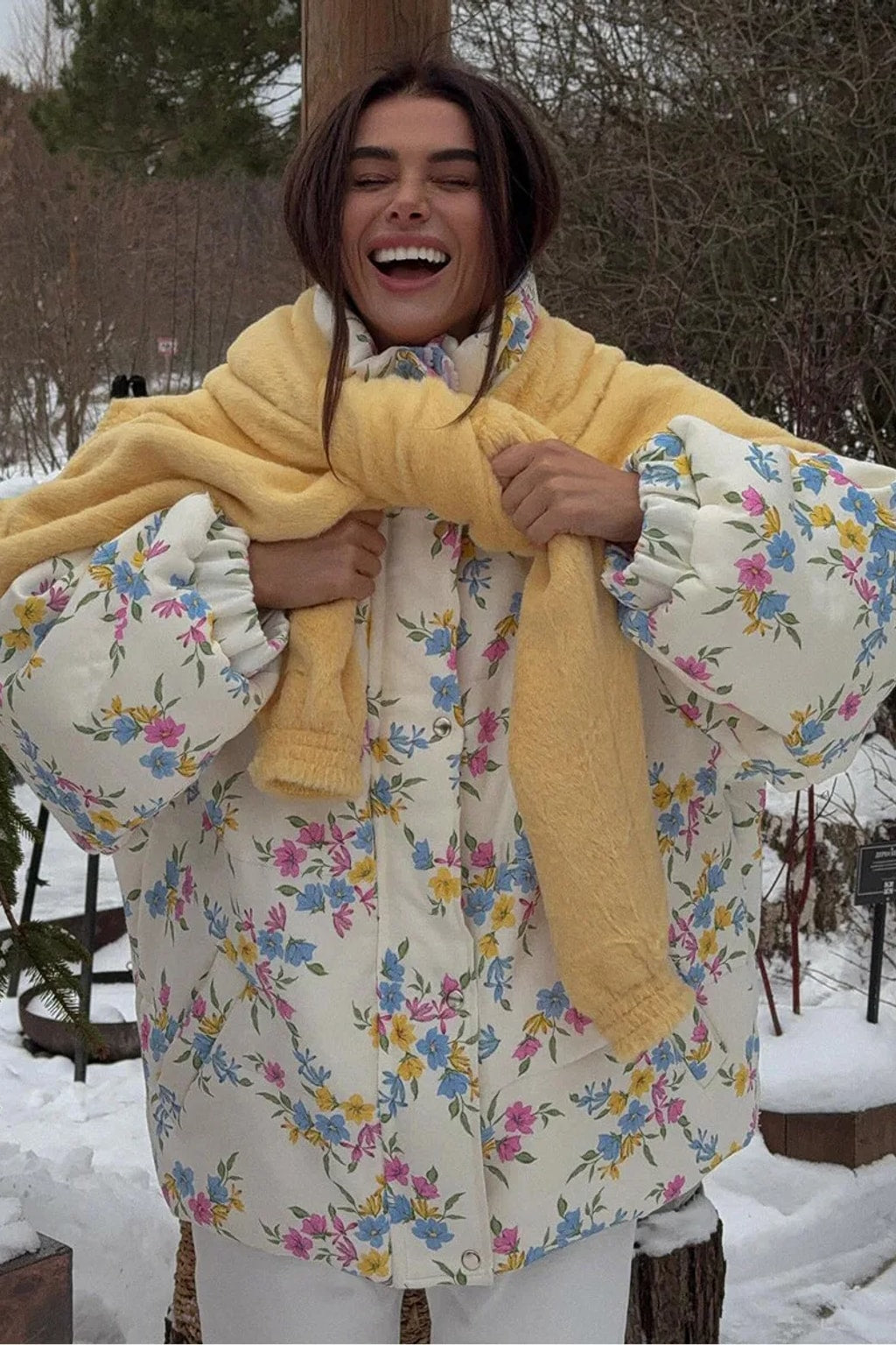 Cream oversized puffer jacket in a ditsy floral print with a tall stand collar and full zip