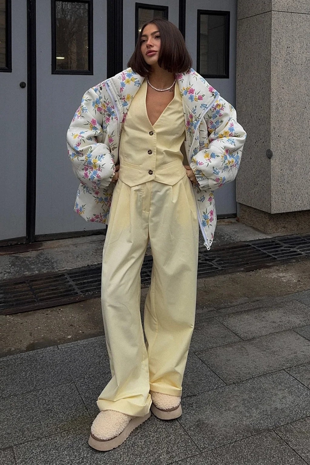 Cream oversized puffer jacket in a ditsy floral print with a tall stand collar and full zip