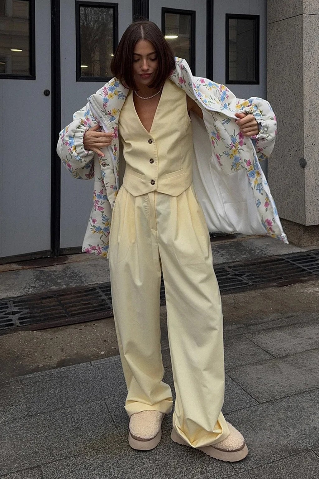 Cream oversized puffer jacket in a ditsy floral print with a tall stand collar and full zip
