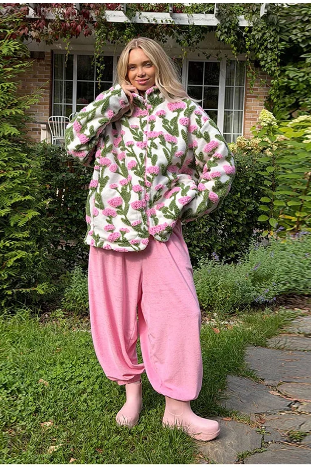 Oversized cream sherpa fleece jacket with raised pink and green floral tufting and a stand collar