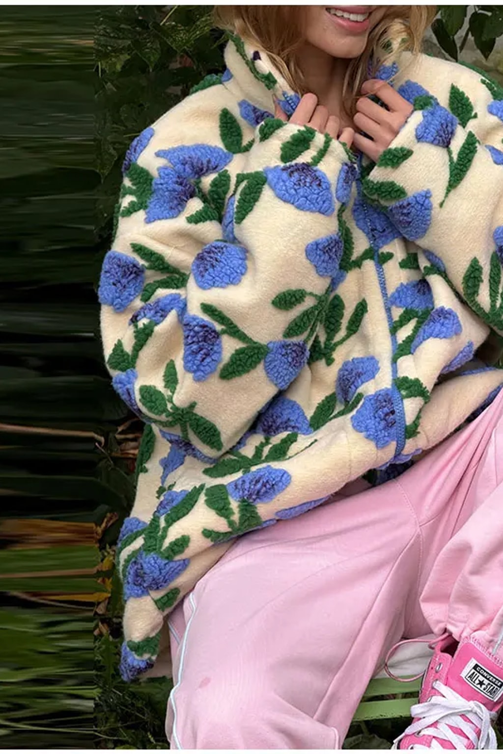 Oversized cream sherpa fleece jacket with raised pink and green floral tufting and a stand collar