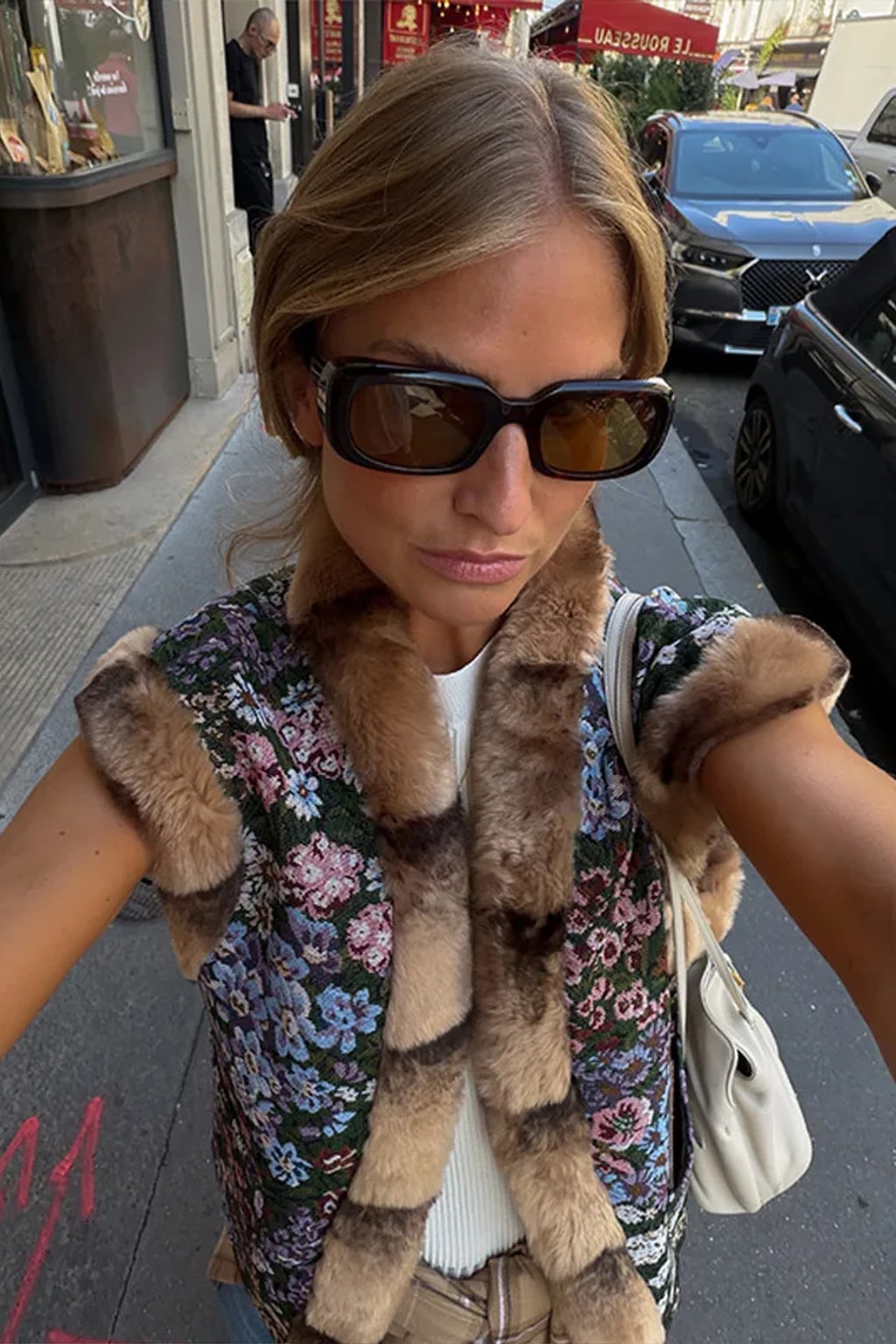 Floral tapestry sleeveless waistcoat edged in brown faux fur at the collar, front and armholes