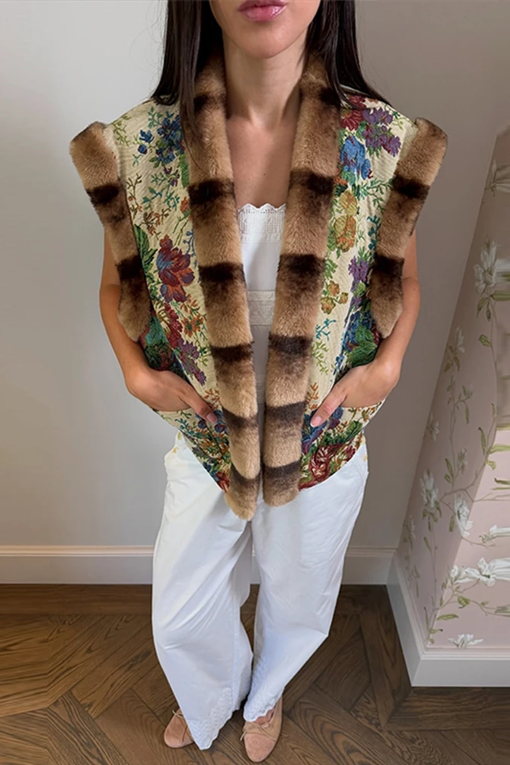 Floral tapestry sleeveless waistcoat edged in brown faux fur at the collar, front and armholes