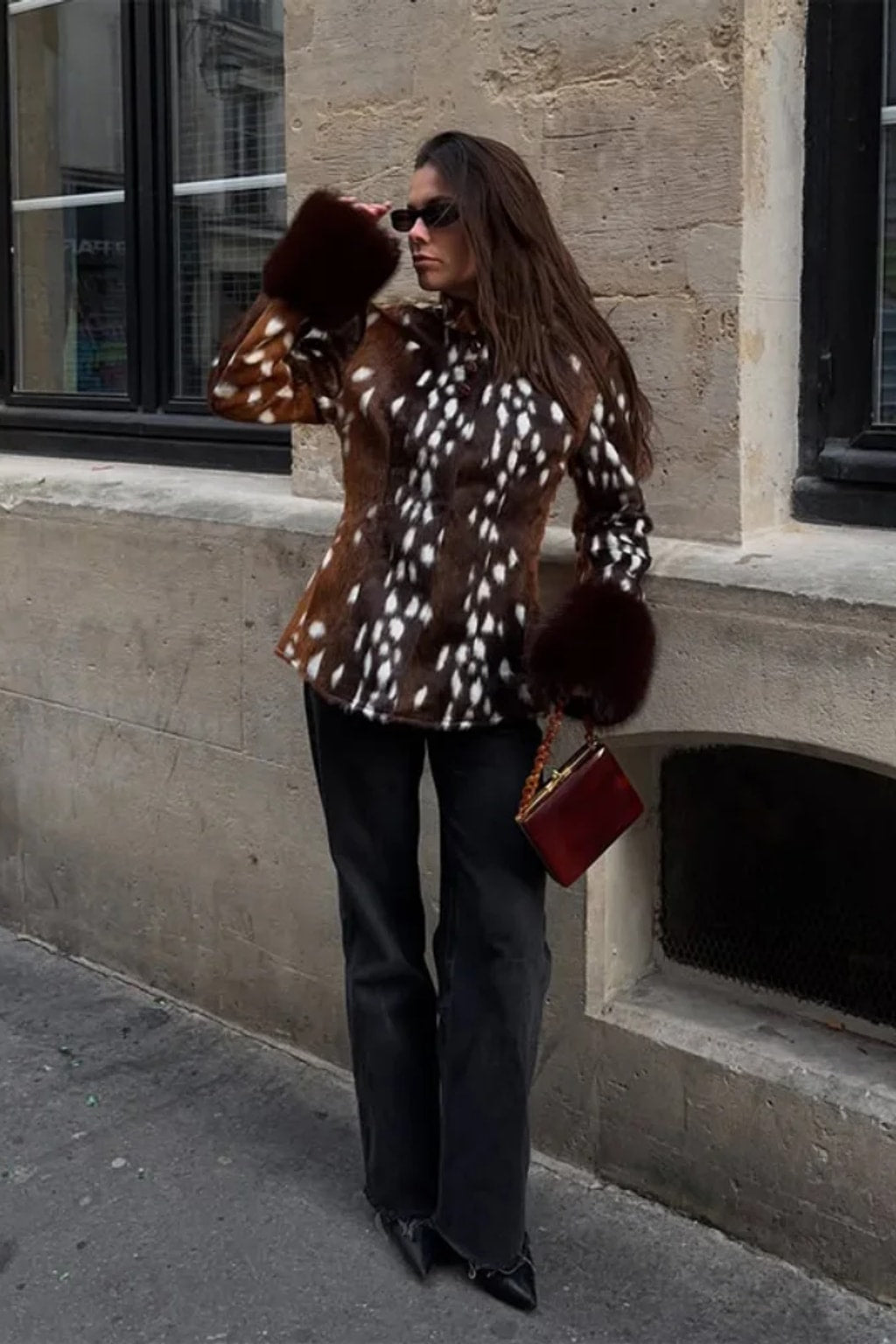 Animal print faux fur jacket with a stand collar, button front and deep contrast dark brown fur cuffs