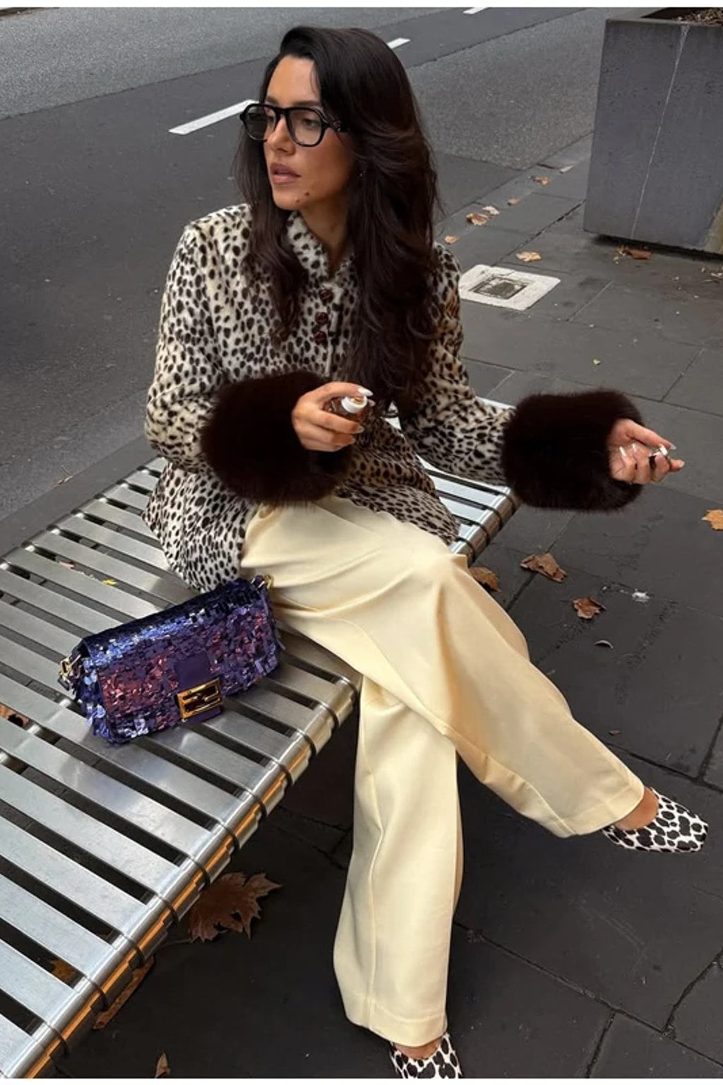Animal print faux fur jacket with a stand collar, button front and deep contrast dark brown fur cuffs