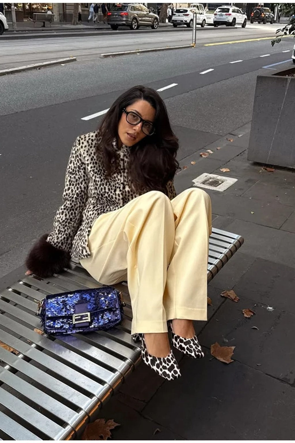 Animal print faux fur jacket with a stand collar, button front and deep contrast dark brown fur cuffs