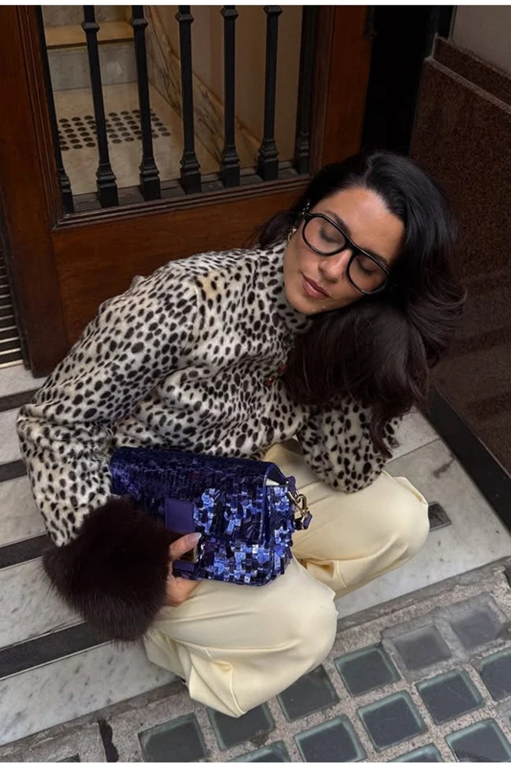 Animal print faux fur jacket with a stand collar, button front and deep contrast dark brown fur cuffs