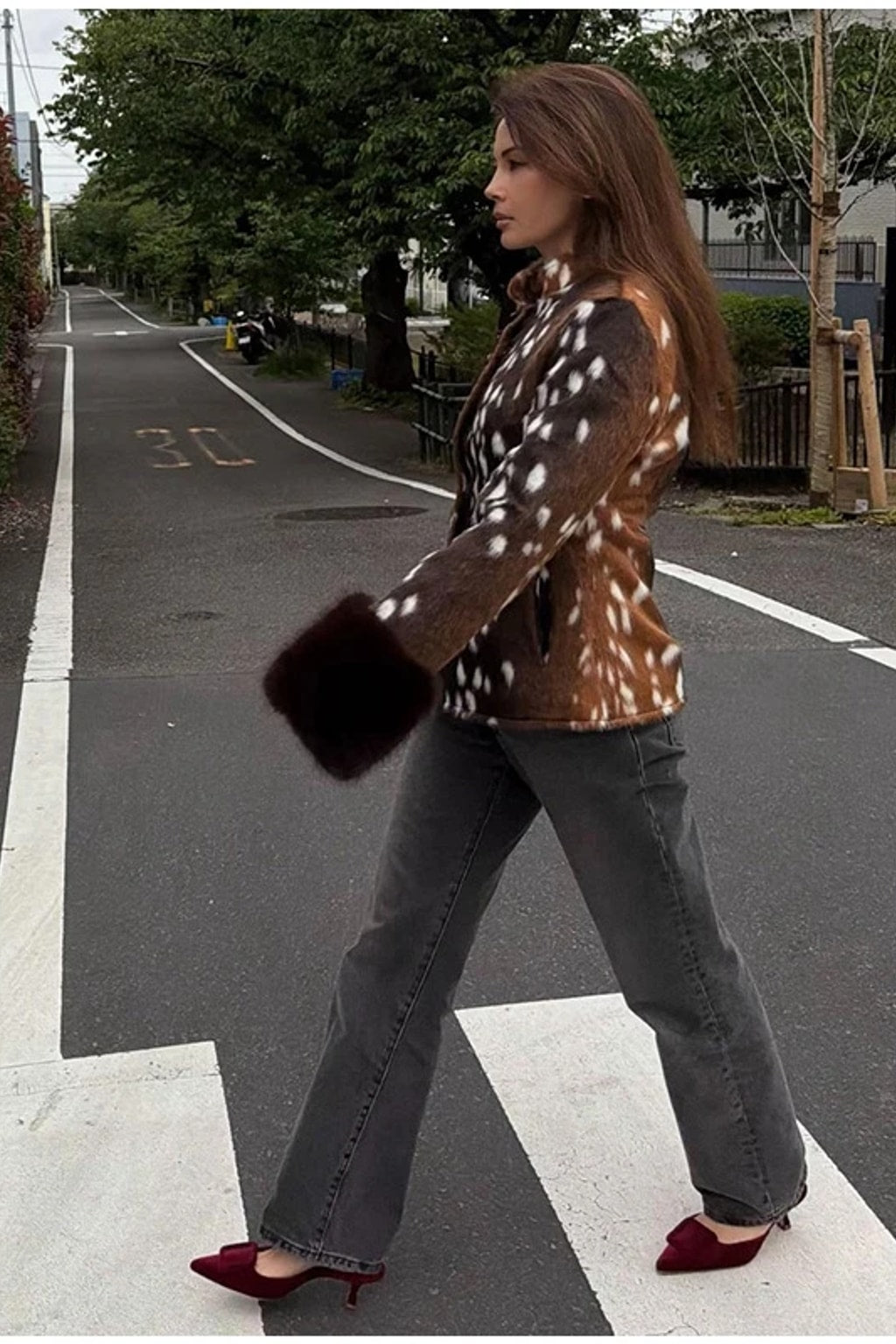 Animal print faux fur jacket with a stand collar, button front and deep contrast dark brown fur cuffs
