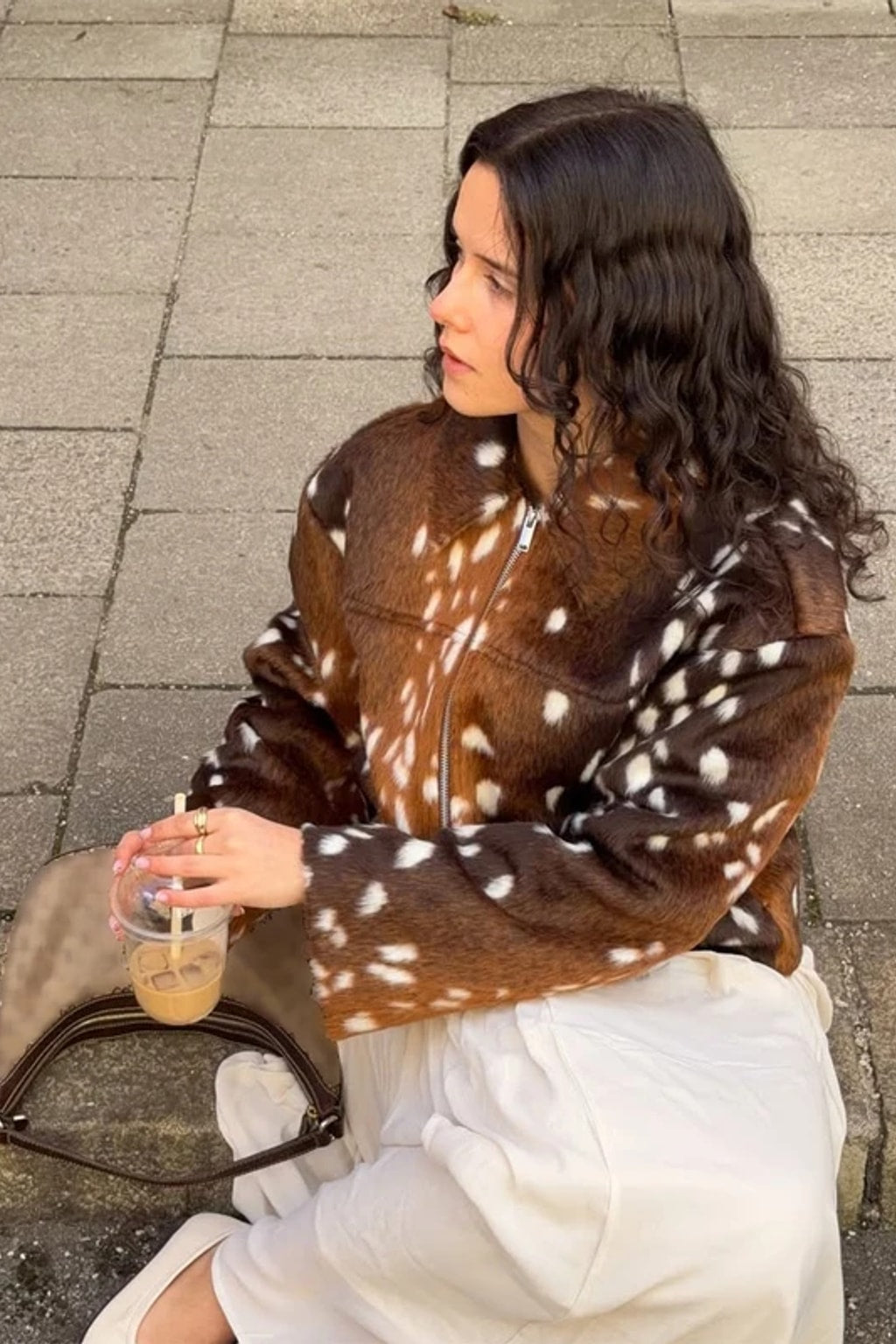Animal print faux fur jacket with a stand collar, button front and deep contrast dark brown fur cuffs
