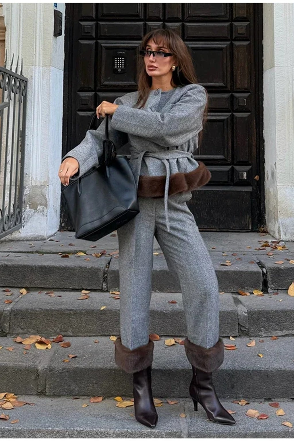 Grey belted jacket with a wide brown faux fur hem band and matching straight leg trousers