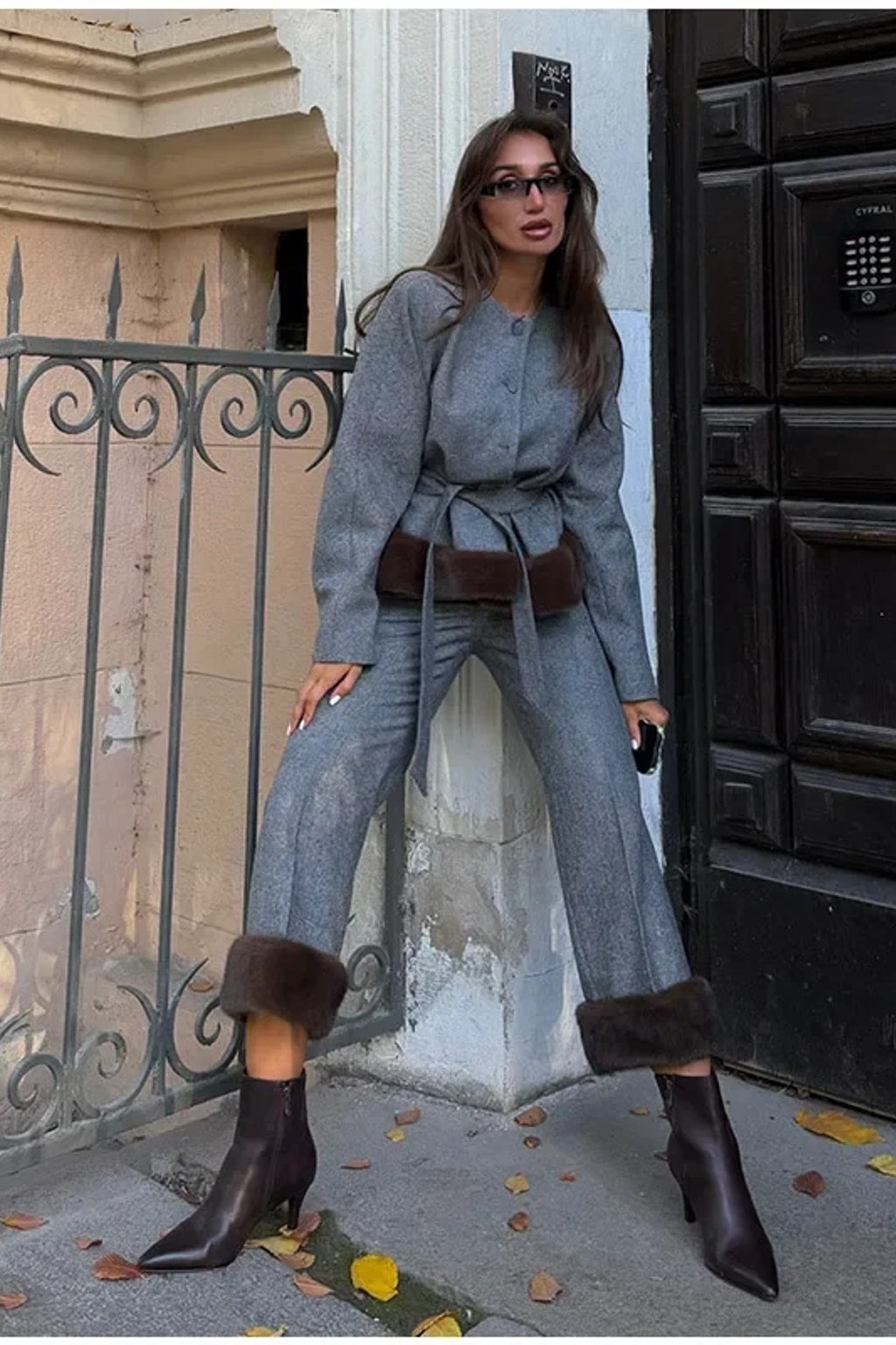 Grey belted jacket with a wide brown faux fur hem band and matching straight leg trousers