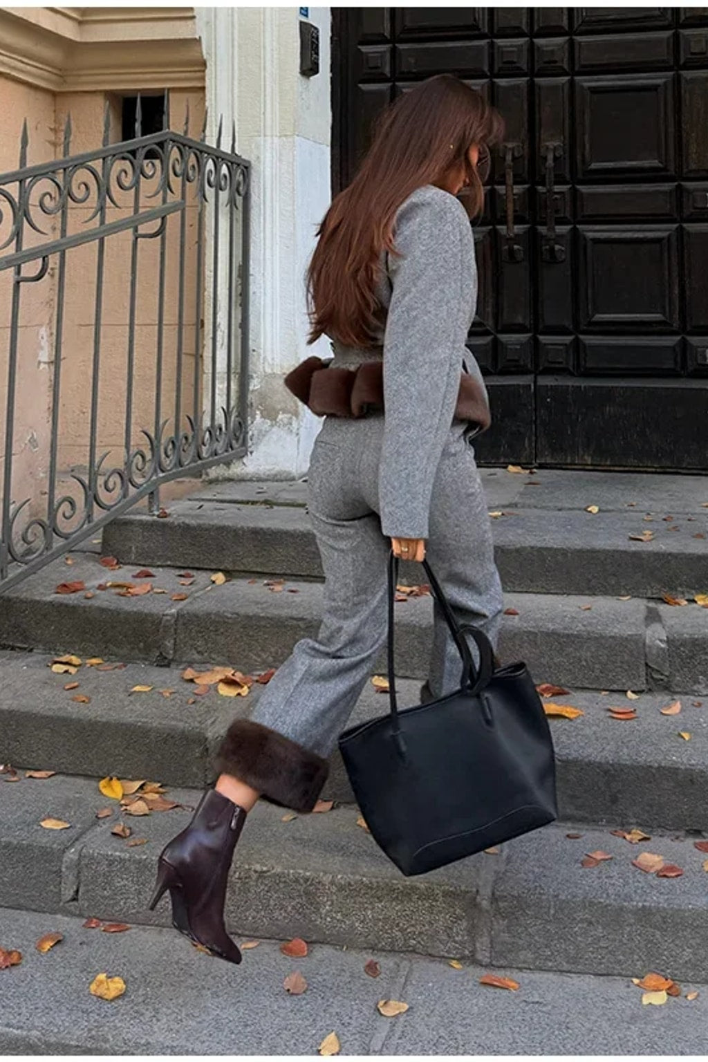 Grey belted jacket with a wide brown faux fur hem band and matching straight leg trousers