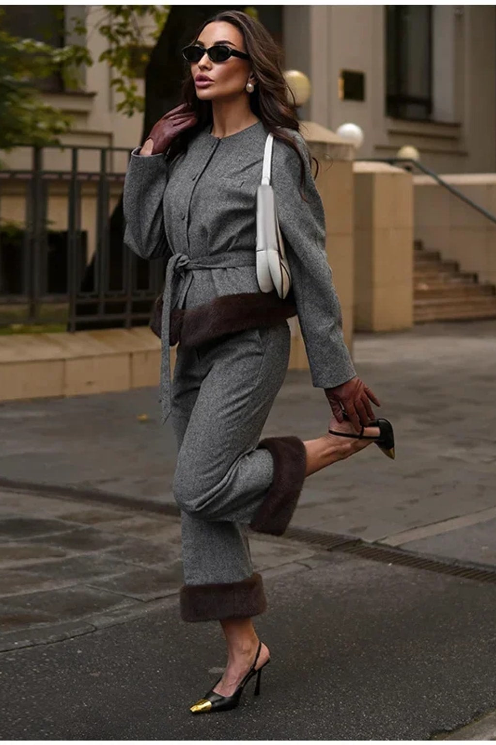 Grey belted jacket with a wide brown faux fur hem band and matching straight leg trousers