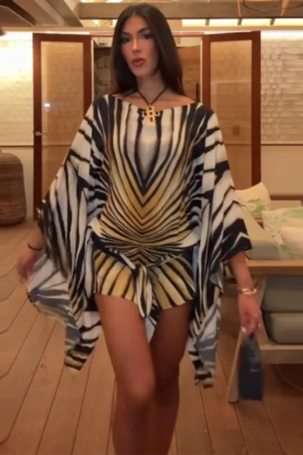 Chiffon kaftan mini dress in a radiating black, cream and gold tiger stripe with wide cape sleeves and a front tie sash