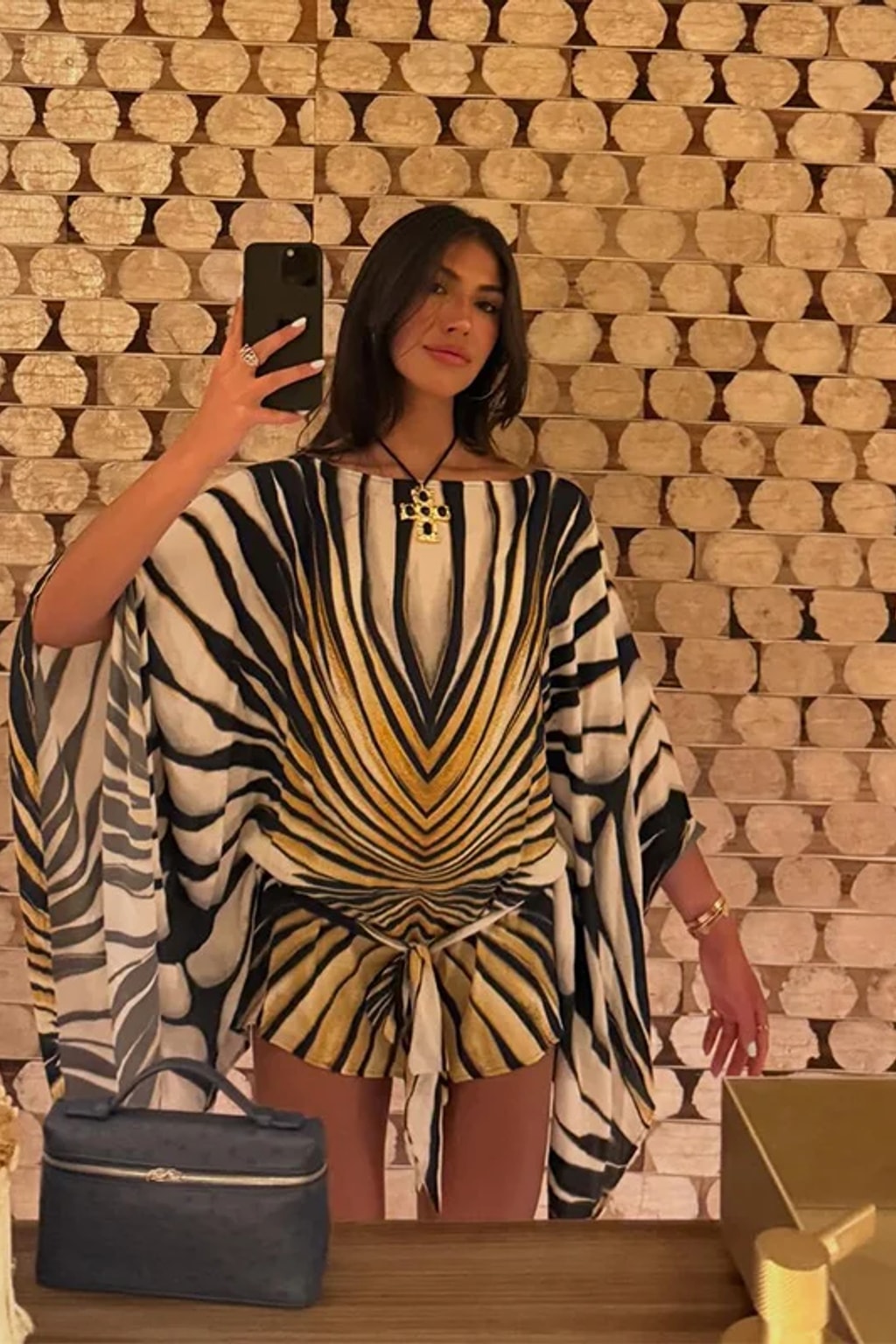 Chiffon kaftan mini dress in a radiating black, cream and gold tiger stripe with wide cape sleeves and a front tie sash